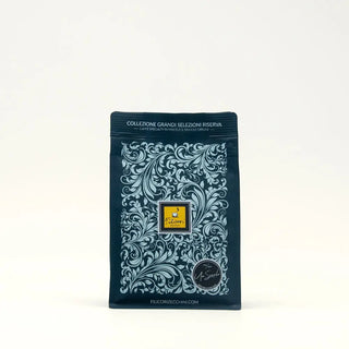 Confezione caffè linea Grandi Selezioni Riserva, blu con motivo floreale.